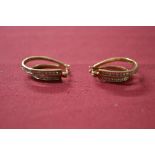 Pair of 9ct gold and Diamond earrings each in a twin graduated hoop shaped design, mounted with