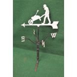 Painted metal weather vase the arrow being surmounted with the figure of man pushing a wheelbarrow -