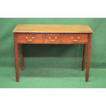 Mahogany three drawer side table the top having moulded edge, standing on square moulded legs ending