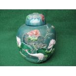 20th century Chinese blue/green glazed jar and cover decorated with crane and lotus the base