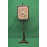 Regency rosewood pole screen having floral decorated screen panel, standing on a triform brass