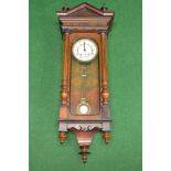 Walnut cased Vienna wall clock having white enamel dial with Roman Numerals and pierced black