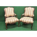 Pair of 20th century mahogany showwood framed armchairs having padded back, arms and seat,