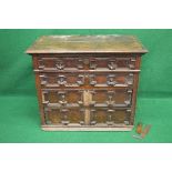 Oak Jacobean chest of drawers the top having moulded edge over four long graduated drawers with