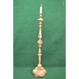 Painted cream standard lamp having bulbous carved and turned column leading to a shaped base and