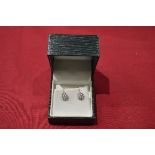 Pair of 9ct white gold and Diamond seven stone cluster ear studs the backs with post and butterfly