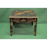 Black lacquered chinoiserie style decorated coffee table having single drawer and standing on shaped