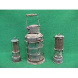 Two miners safety lamps, one by The Premier Lamp & Engineering Co. Ltd - Leeds together with a large