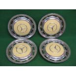 Four Mercedes metal wheel trims with cream painted centres - total 15.25" in dia Please note