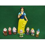 Un unattributed hollow plaster cast model of Snow White - 18" tall together with all seven dwarfs in