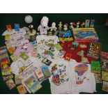 Collection of Snoopy items to include: figures, lamp, t-shirts etc, paperbacks, boxed road racing
