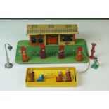 Mid 20th C tin plate garage with petrol pumps, made in England, with Tecalemit logo to front of