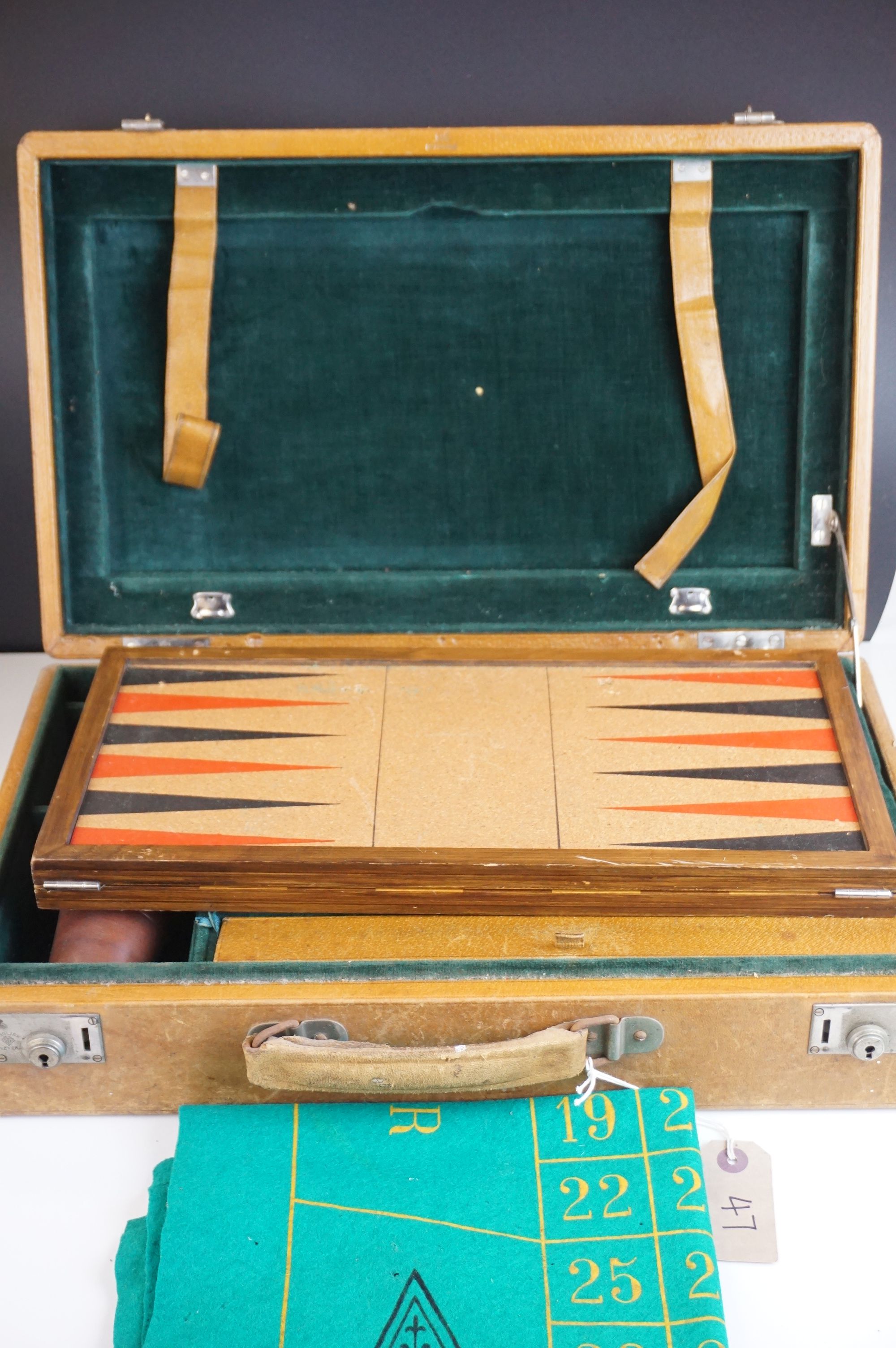 A vintage cased games compendium including back gammon and roulette wheel etc