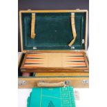A vintage cased games compendium including back gammon and roulette wheel etc