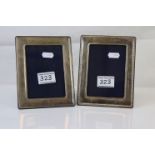 A pair of fully hallmarked sterling silver photograph frames.
