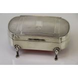 Art Deco Silver Trinket Box with engine turned decoration and plain cartouche, raised on four