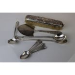 A collection of hallmarked sterling silver items to include spoons and a silver backed brush.