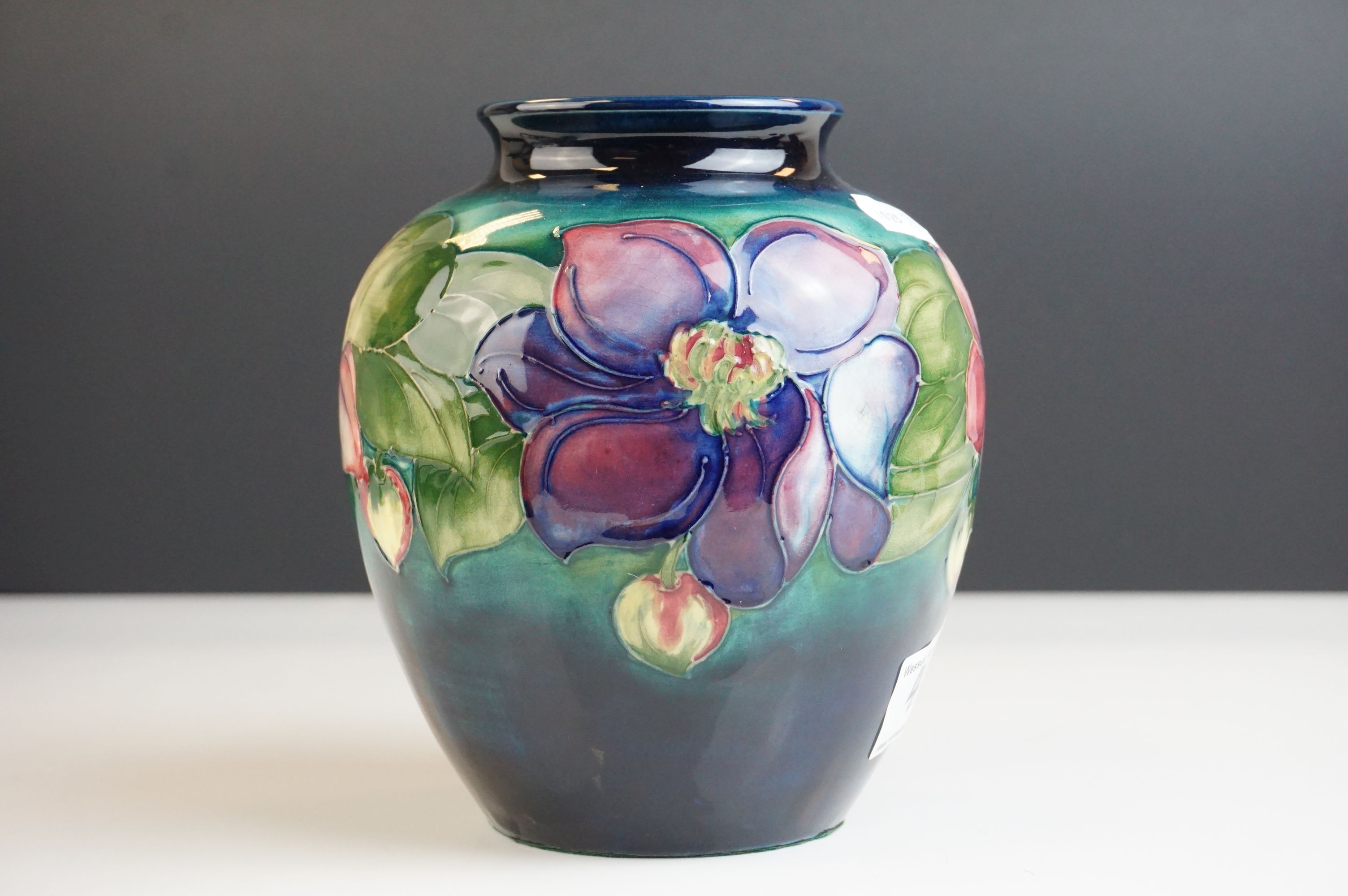 Moorcroft Globular Vase in the Clematis pattern on a green ground, Moorcroft signature to base and
