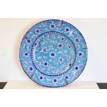 Large Iznic style ceramic Charger with Floral decoration on blue ground, 43cms diameter