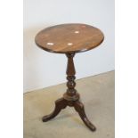 Stained Wooden Circular Wine / Lamp Table raised on a turned column and three legs, 46cms diameter x