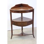 George III Mahogany Bow Fronted Corner Washstand, the under tier shelf with a drawer and two faux