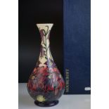 Moorcroft Bottle Neck Vase with tubed lined floral pattern, impressed marks to base and dated