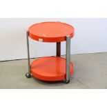 Mid 20th century Retro Circular Chrome and Orange Plastic Two Tier Trolley raised on three