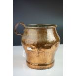 Antique Copper Measuring Pot with a riveted handle, 19cms high