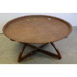 Large Indian / Eastern Circular Copper Tray Top Table, raised on a hardwood folding stand with brass