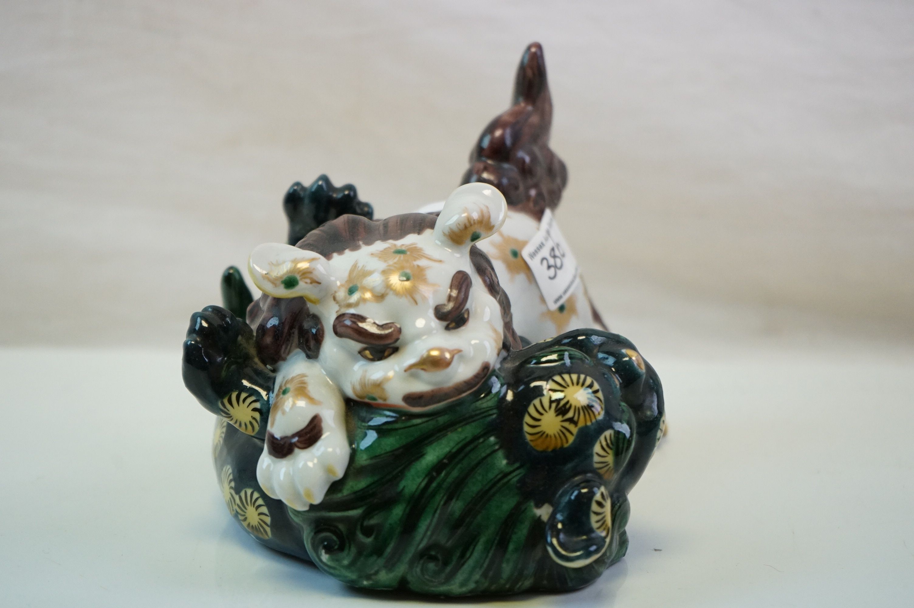 A ceramic Japanese figure of two lions fighting. - Image 2 of 6