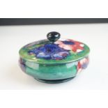 Moorcroft Lidded Squat Jar in the Anemone pattern on green ground, impressed ' Moorcroft ' and '
