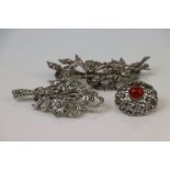 A collection of three vintage marcasite brooches to include a silver example.