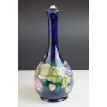 Moorcroft Lamp Base in the Clematis pattern on a blue ground, Moorcroft signature and impressed '