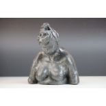 A pottery sculpture of a stylized women.