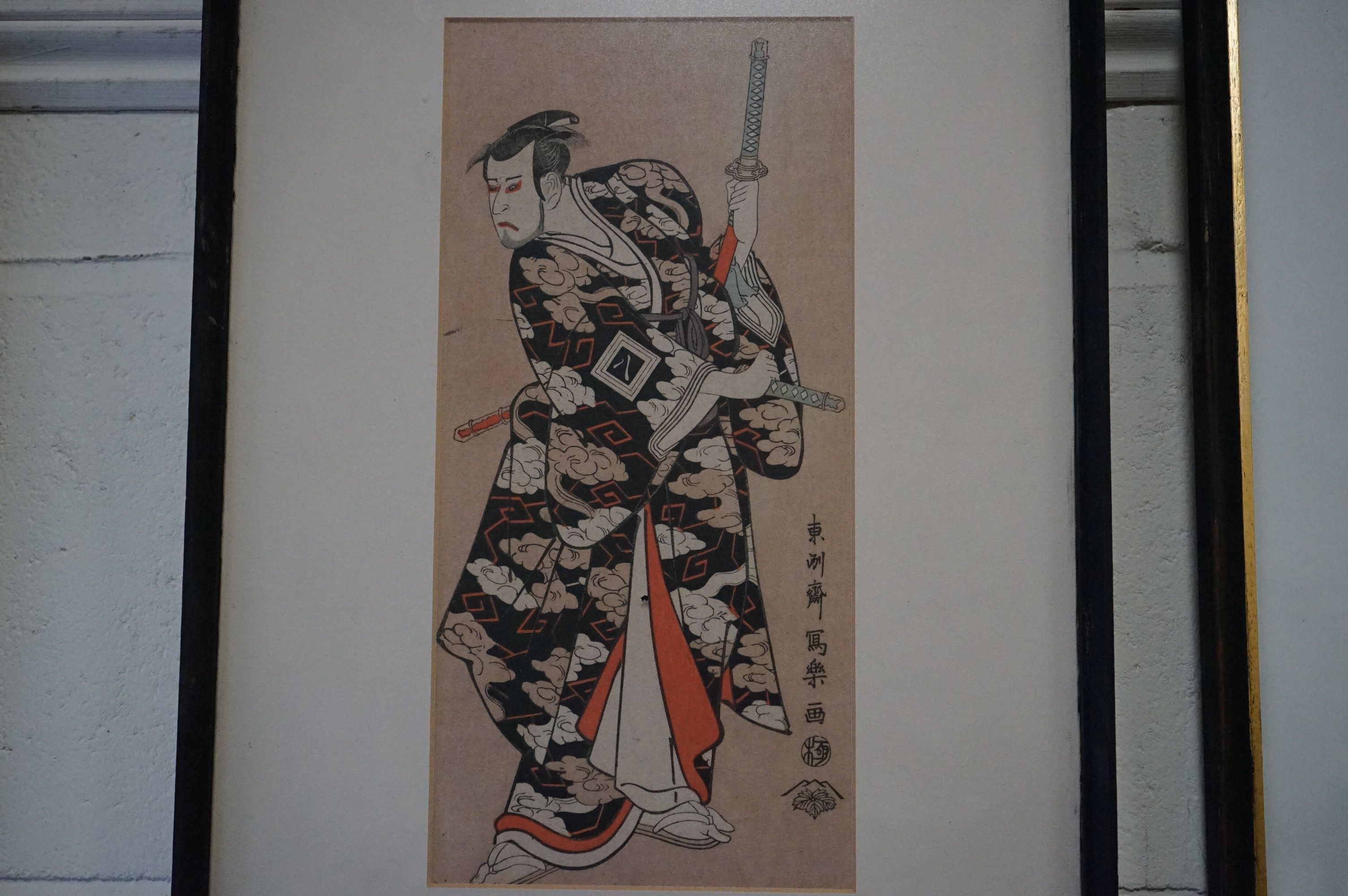 Toshusai Sharaku, a Framed Japanese Woodblock of an Actor in Traditional Costume, text on verso - Image 2 of 2