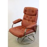 Mid 20th century Retro Tan Leather Swivel Lounge Chair with a tubular chrome frame and spoked