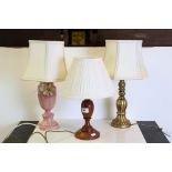 Three contemporary lamps with shades.