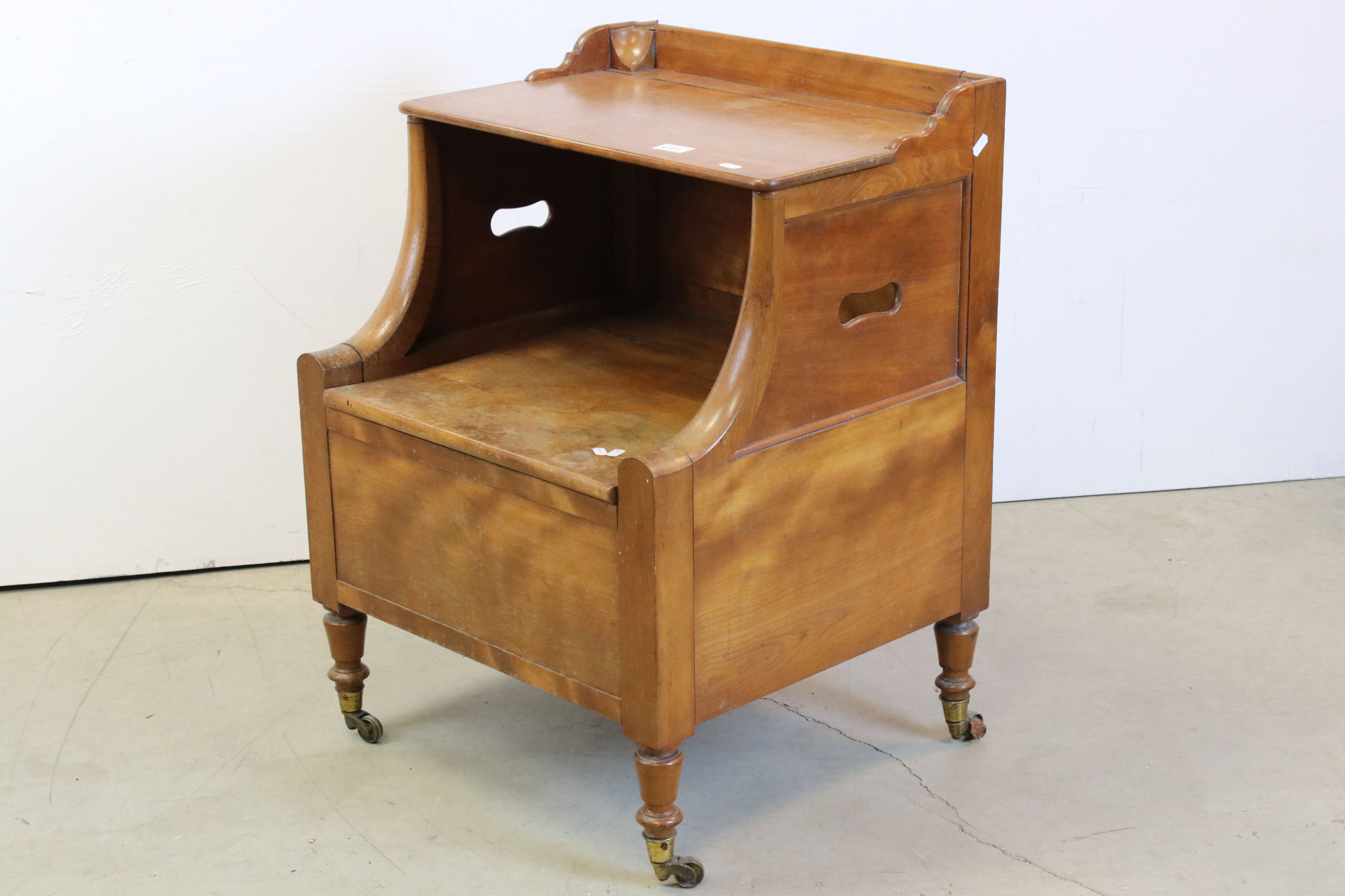 Victorian Walnut Box Seat Commode, with hinged lid above a hinged seat, raised on a turned legs with