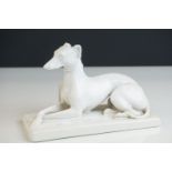 Minton's blanc de chine ceramic recumbent Greyhound dog marked to underside Mintons England, 18cms
