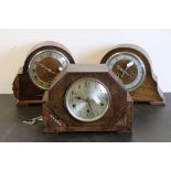 Three oak cased mid 20th century mantel clocks together with one clock key