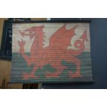 Canvas Hanging Banner of Welsh Dragon Flag, supported on wooden poles, 95cms x 70cms
