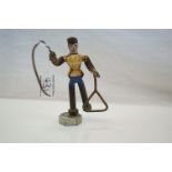 A novelty metal sculpture of a Circus trainer with whip constructed from Engineering items.