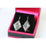 Pair of Silver Diamond shaped Earrings set with Aquamarines to the centre