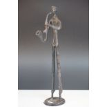 Bronze stylized figure of a man playing a Saxophone, 42 cm tall.