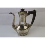A vintage Queen Anne pattern sterling silver coffee pot.
