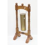 Table Gong formed from a Military Brass Shell dated 1954 held on a Hardwood Frame, 65cms high