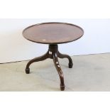 Early 19th century Mahogany Tray top Circular Table, raised on a turned bulbous support and three