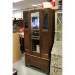 Early 20th century Oak Wardrobe with single mirrored door over a drawer below (lacking pediment),