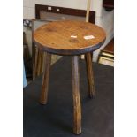 Rustic Oak and Elm Circular Stool raised on three chamfered legs, 41cms high x 30cms diameter