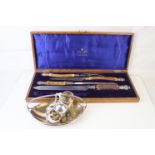 A cased Mappin & Webb carving set with antler handles and hallmarked silver mounts together with a